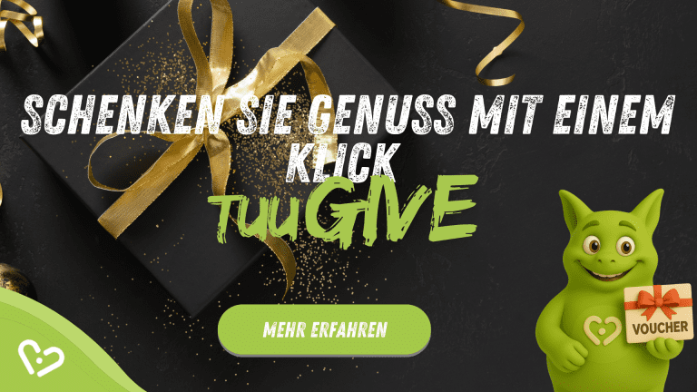 chwarze Geschenkbox mit goldener Schleife; Tuutuu hält einen Gutschein. Bildtext: 'Schenken Sie Genuss mit einem Klick – TuuGIVE'.